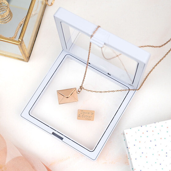 Necklace with engraved message in envelope