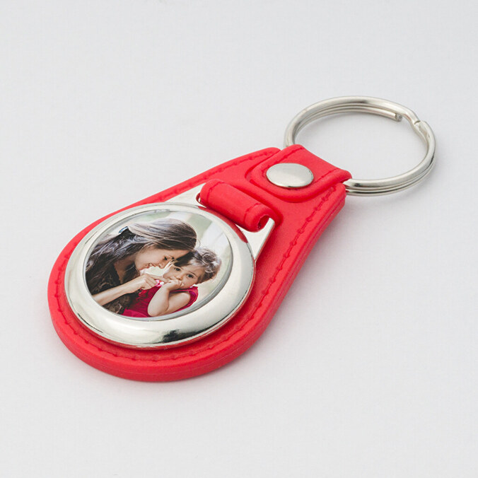 Ronde metalen sleutelhanger met kunstleer bedrukken