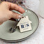 Personalised wooden keyring with the shape of a house