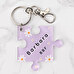 Personalised acrylic keyring with the shape of a puzzle piece