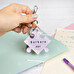 Personalised acrylic keyring with the shape of a puzzle piece