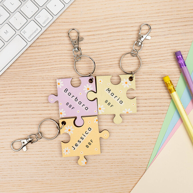 Personalised wooden keyring with the shape of a puzzle piece