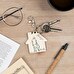 Personalised wooden keyring with the shape of a house